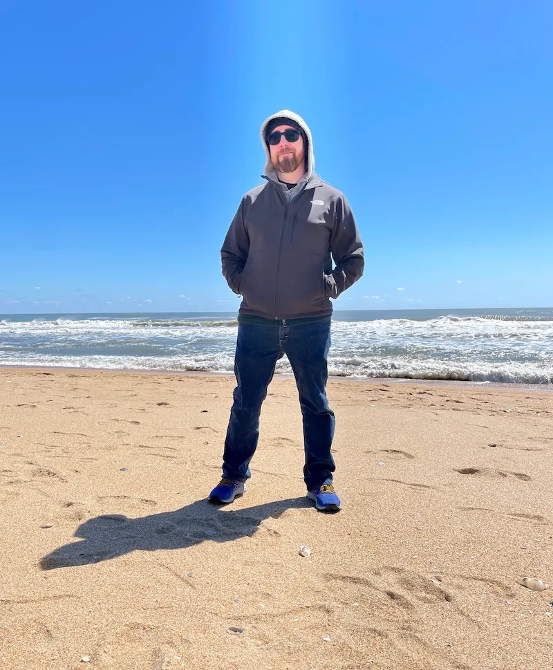 photo of Patrick Doran living in the moment  on the beach, not thinking about the intenet at all