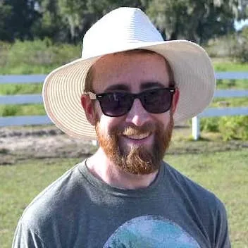 Photograph of Patrick Doran wearing a hat